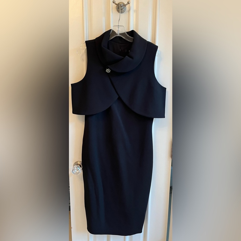Snap closure sleeveless dress with gem snap detailing. Hidden zip in back
